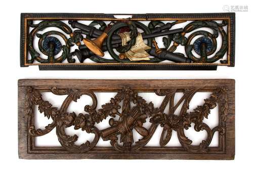 Two Dutch oak and polychrome decorated carved oak and limewood overdoor panels