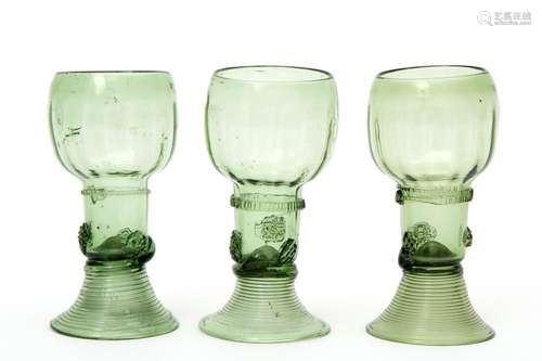 Three small green roemer glasses