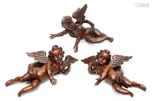 Three Italian carved wood putti