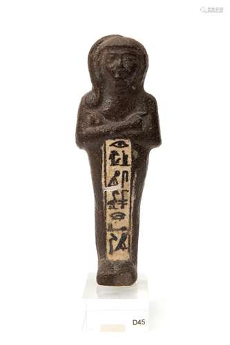 An Egyptian brown and white faience Ushabti