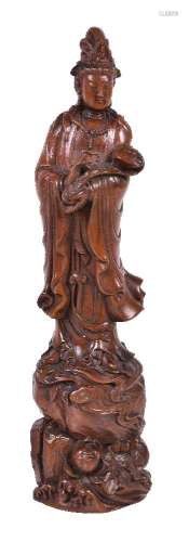 A Chinese carved wood figure of Guanyin
