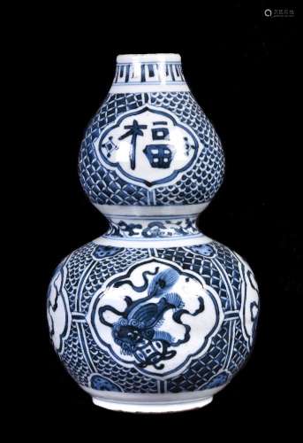 A Chinese blue and white double gourd vase