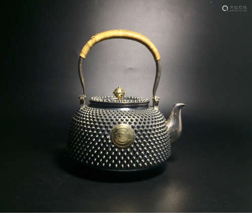 A SILVER TEAPOT WITH GILT BRONZE HANDLE