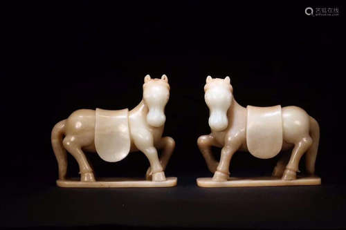 A PAIR OF HETIAN JADE HORSE ORNAMENTS