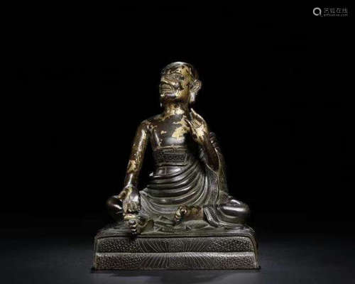 A COPPER GILT CARVED LUOHAN BUDDHA