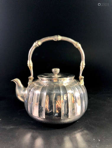 A SILVER TEAPOT WITH GUANGNAN MARKING