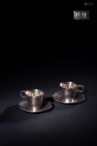 A SILVER COFFEE CUP