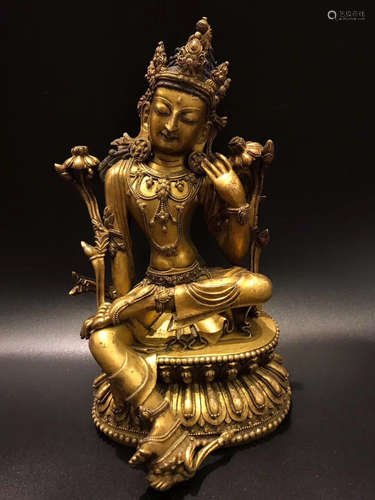 A GILT BRONZE FEMALE BUDDHA FIGURE