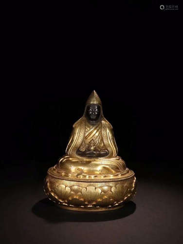 A BUDDHIST GILT BRONZE BUDDHA FIGURE