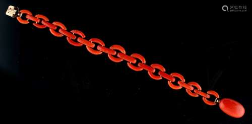 A coral link bracelet, the clasp tongue with French 9ct gold cloverleaf mark, 6.9ins. (17.5cms.)