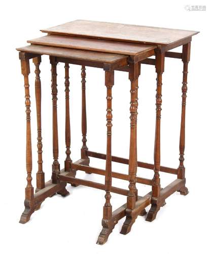 Property of a lady of title - a nest of three rectangular topped occasional tables with turned