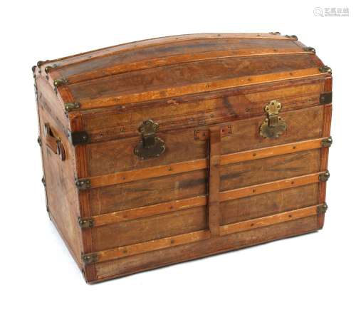 Property of a deceased estate - a late 19th century tooled leather domed top trunk with fitted