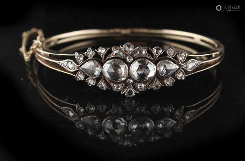 An early / mid Victorian unmarked yellow gold & rose cut diamond hinged bangle, the estimated