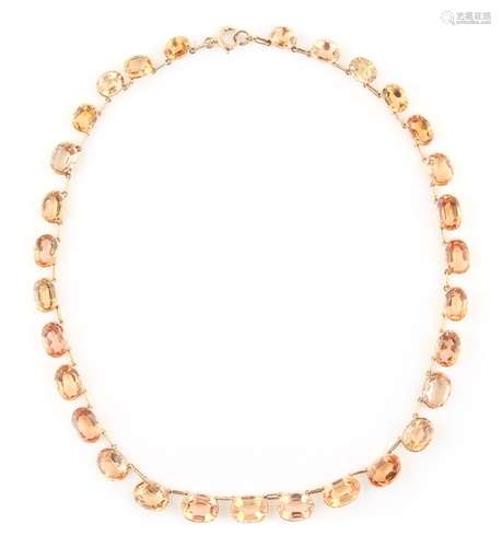 A late Georgian topaz riviere necklace, the thirty graduated topaz collets weighing an estimated