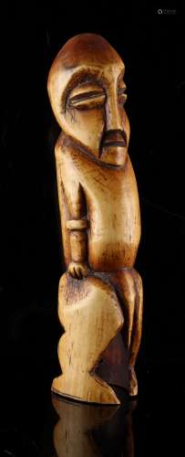Property of a gentleman - an African tribal carved ivory figure of a standing man, probably Lega,
