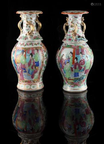 Property of a lady - a pair of 19th century Chinese Canton famille rose baluster vases, painted with
