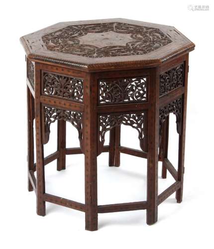 Property of a gentleman - an Indian carved teak & brass inlaid octagonal folding table, 23ins. (58.