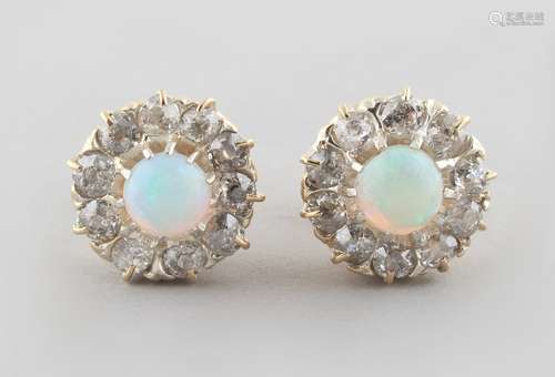 A pair of opal & diamond cluster earrings, with post & butterfly fastenings, each with an opal set