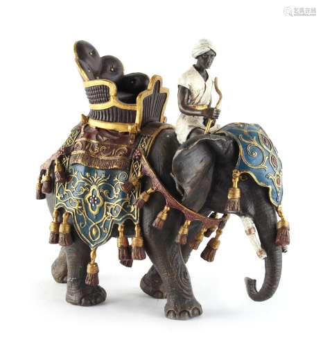 Property of a lady - a cold painted bronze model of a caparisoned elephant with howdah & rider,