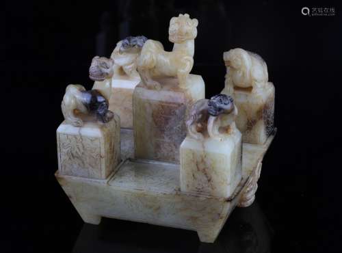 A Set of Six Carved Jade Seals with Stand