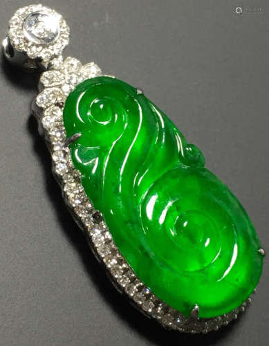 A GREEN JADEITE CARVED CLOUD PENDANT, TYPE A