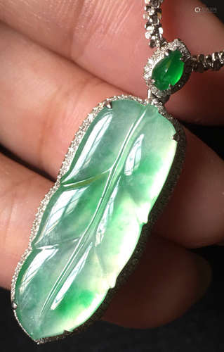 A GREEN JADEITE CARVED LEAF PENDANT, TYPE A