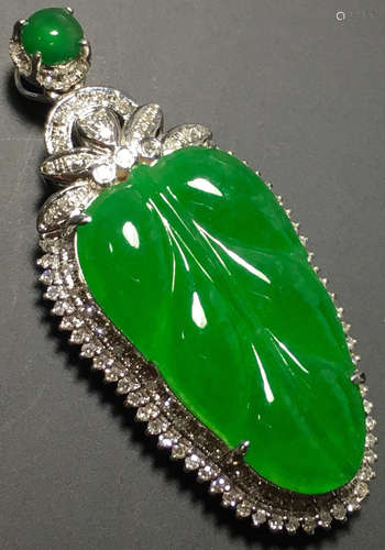 A GREEN JADEITE CARVED LEAF PENDANT, TYPE A