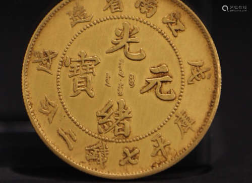 A GOLD CASTED QING DYNASTY COIN