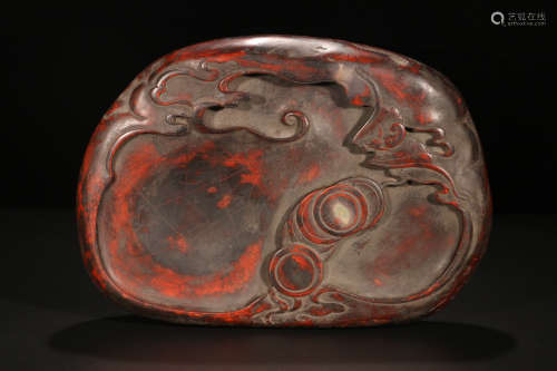 A RED STONE CARVED CLOUD PATTERN INK SLAB