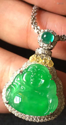 A GREEN JADEITE CARVED BUDDHA PENDANT, TYPE A