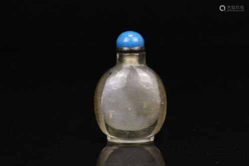 A CRYSTAL CARVED SNUFF BOTTLE