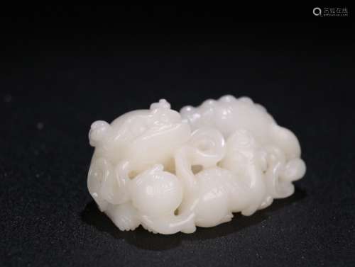 A HETIAN JADE STORY SHAPED ORNAMENT