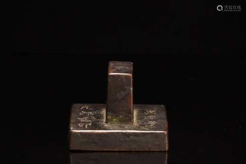 A BRONZE SQUARE SHAPED SEAL