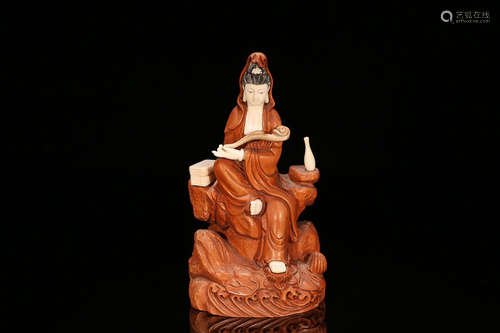 A HUANGYANG WOOD BUDDHA WITH TREASURE EMBEDDED