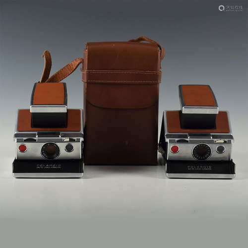 PAIR OF ICONIC VINTAGE POLAROID SX-70 LAND CAMERAS