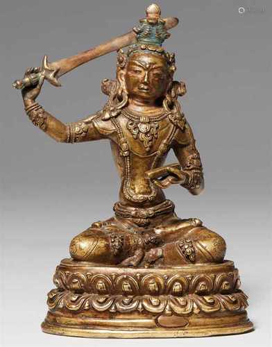 Figur des Manjushri. Bronze. Tibet. 15./16. Jh.Der Bodhisattva der Weisheit thront auf einem