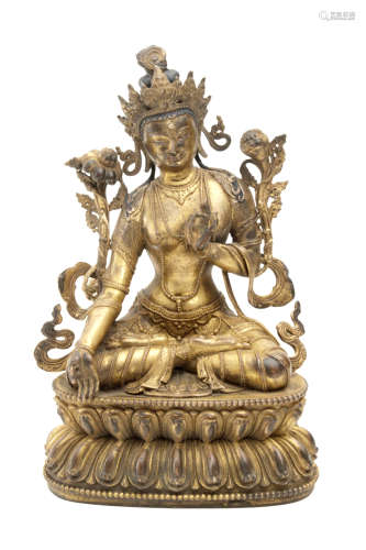 Late 19th century-early 20th century Tibetan school. Seated Buddha sculpture in gilt bronze