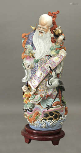 Chinese figure of a wiseman circa 1950 in Famille Rose porcelain