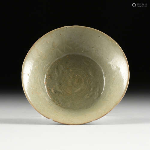 A CHINESE LONGQUAN TYPE CELADON GLAZED RELIEF CARVED EARTHENWARE BOWL, IN THE SONG DYNASTY (960-