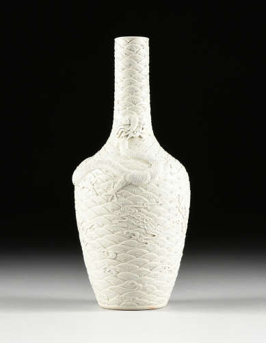 A CHINESE BLANC DE CHINE DRAGON RELIEF VASE, IMPRESSED MARK, LATE 20TH CENTURY, of mallet form