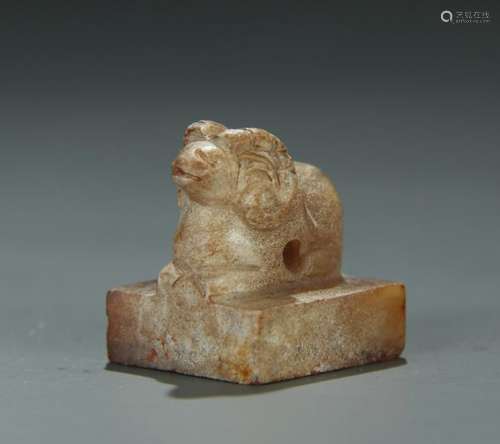 An archaic jade carved seal/ram finial