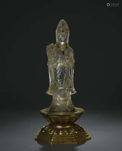 A rock crystal carved Guanying figure with gilt bronze