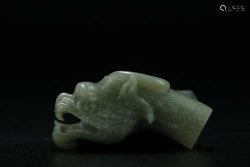 Archaic celadon jade carved dragon figure