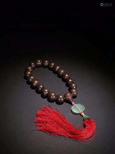 A CHENXIANG WOOD BRACELET WITH 18 BEADS