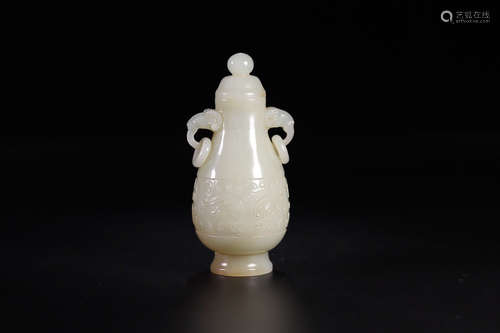 A HETIAN JADE DOUBLE EAR VASE WITH GOAT DESIGN