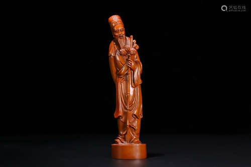 A HUANGYANG WOOD OLD CHARACTER STATUE