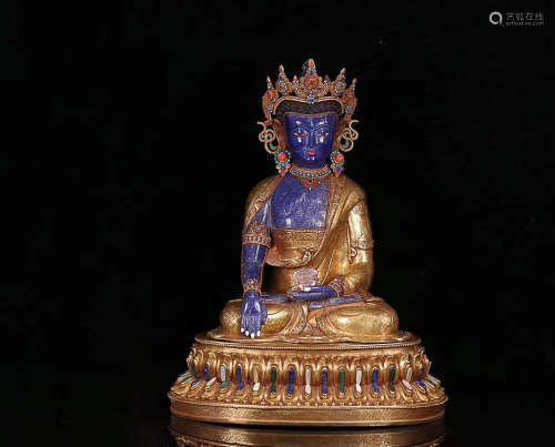 A GILT BRONZE EMBEDED LAPIS LAZULI BUDDHA