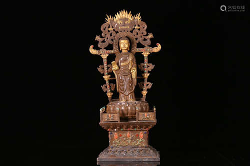 A SILVER BUDDHA STATUE WITH PARTIAL GILT BRONZE AND EMBEDED WITH GEM