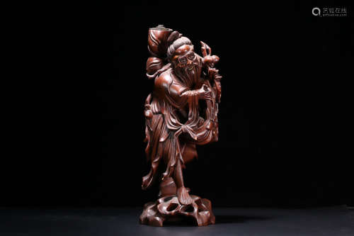 A HUANGYANG WOOD OLD CHARACTER STATUE ORNAMENT