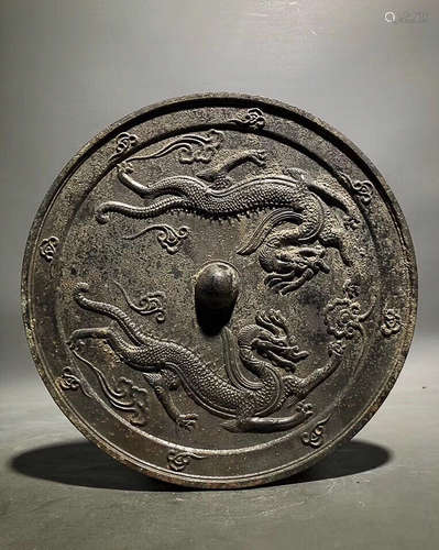 A BRONZE MIRROR WITH TWO DRAGON PATTERN